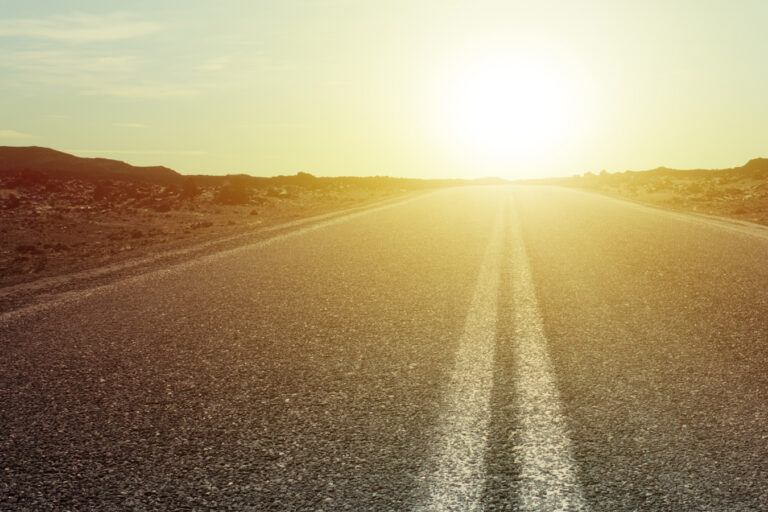 photo of an open road at dawn