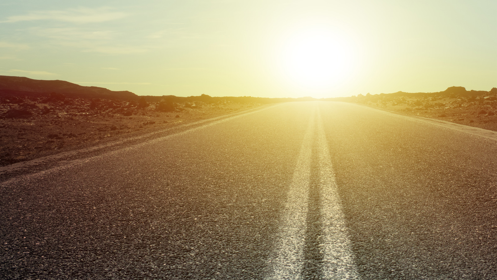 photo of an open road at dawn