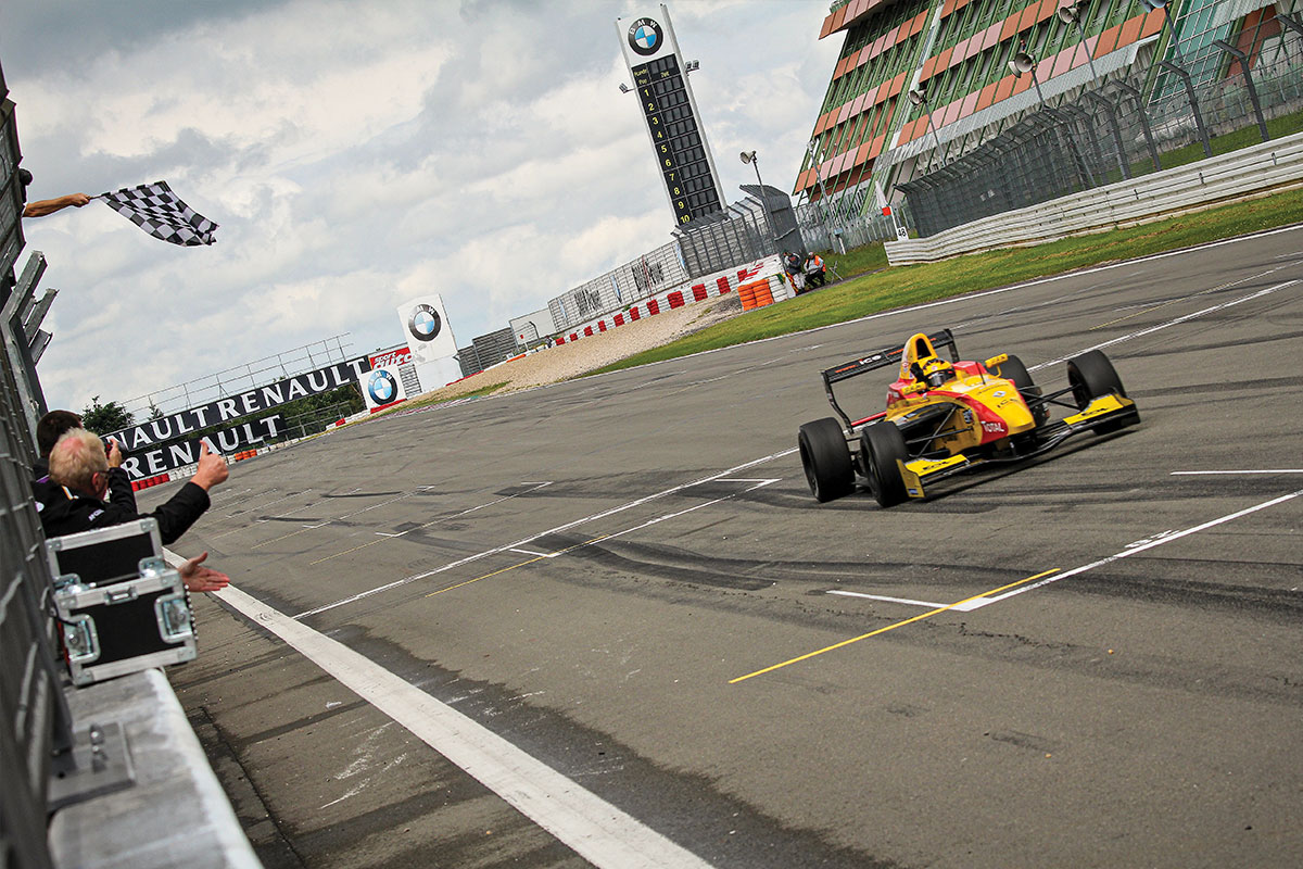 car crossing the finish line at the nurburgring