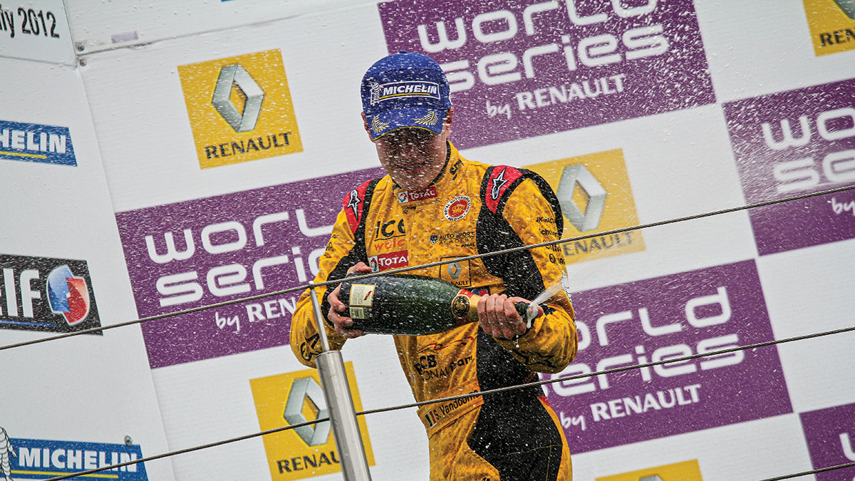 racing driver on the podium